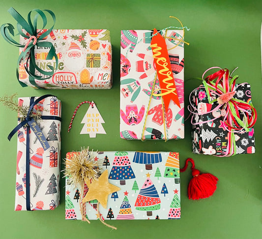 Brightly decorated holiday packages displayed as seasonal promotional gifts, highlighting best promotional items for business branding.