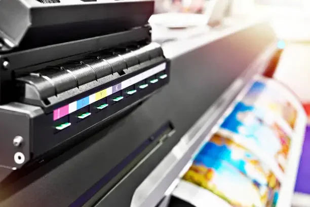 Inkjet printer printing high-quality images on paper, a visual example for understanding types of printing processes.